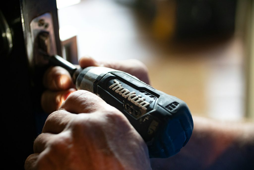 Cordless drill in use during a FixItFast repair